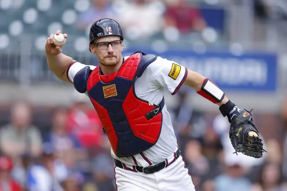 Sean Murphy of the Atlanta Braves fields and throws to first during the seventh inning against the Miami Marlins at Truist Park on August 10, 2025 in Atlanta, Georgia.